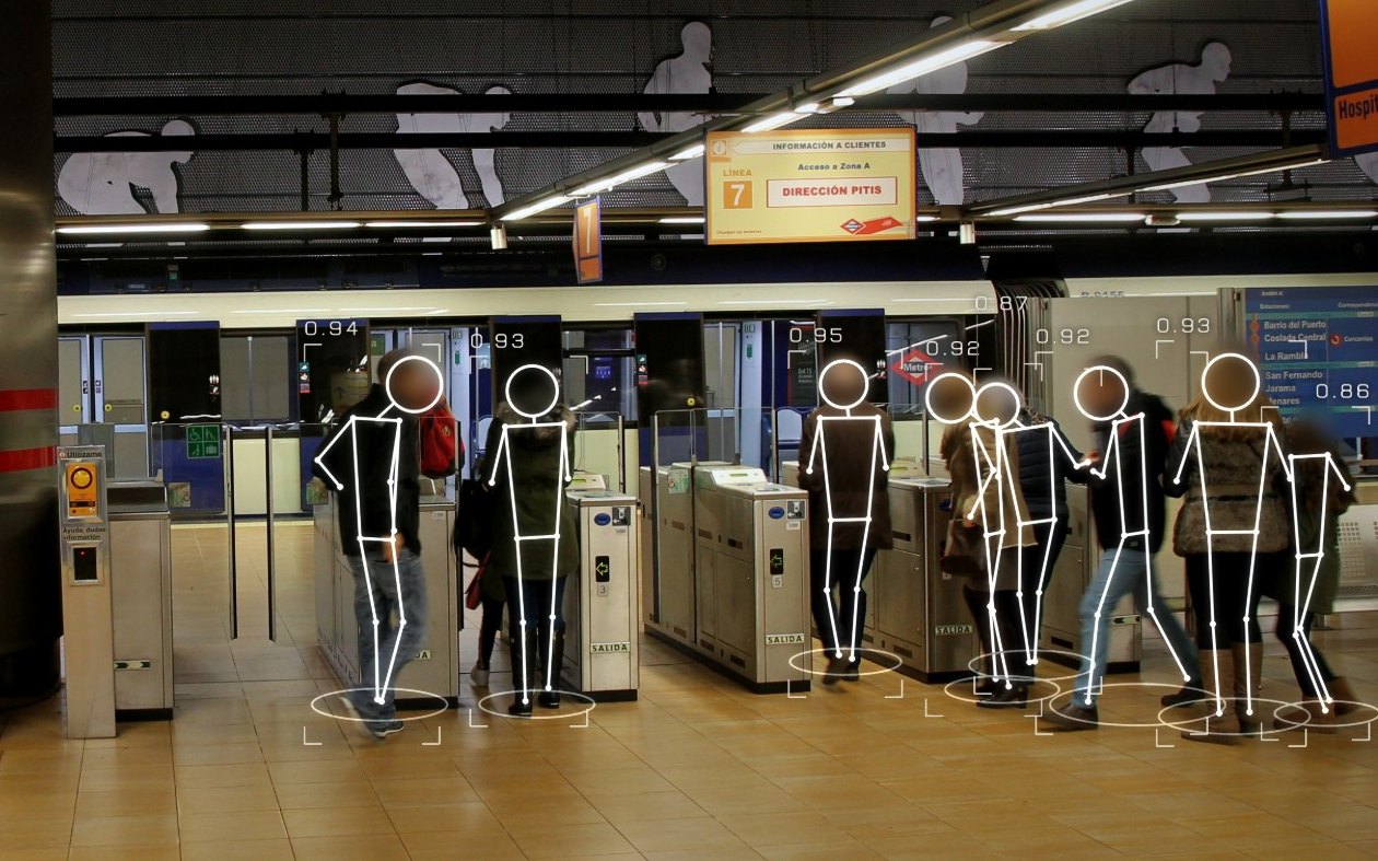 Sentinel tracking passengers at metro fare gates, faces masked